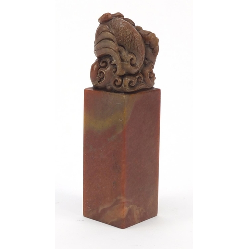 587 - Chinese soapstone seal carved with a dragon, character marks to the base, 12cm high