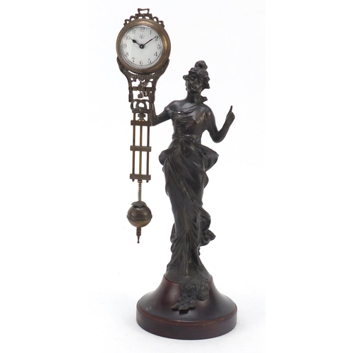 193 - Patinated bronzed mystery clock in the form of an Art Nouveau female, 33.5cm high