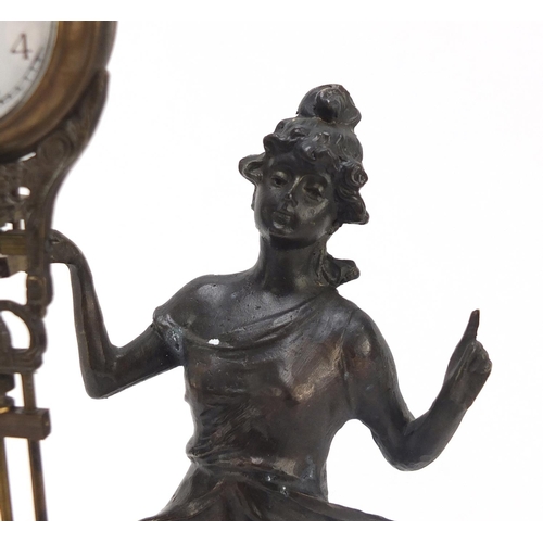 193 - Patinated bronzed mystery clock in the form of an Art Nouveau female, 33.5cm high