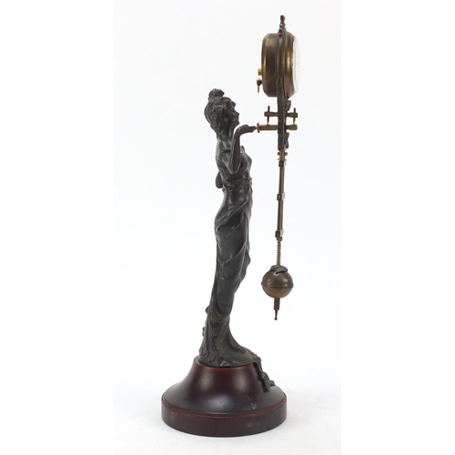 193 - Patinated bronzed mystery clock in the form of an Art Nouveau female, 33.5cm high