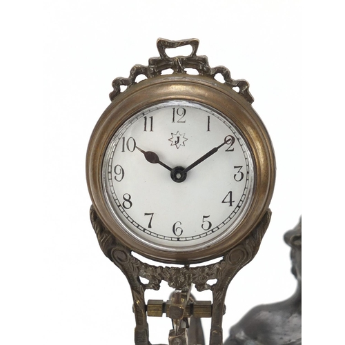 193 - Patinated bronzed mystery clock in the form of an Art Nouveau female, 33.5cm high