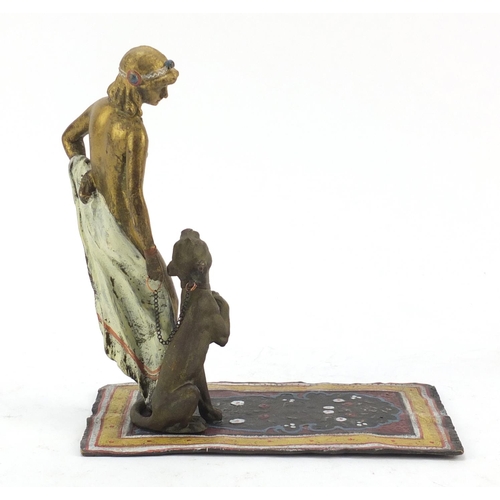 150 - Cold painted bronze of a nude female with dog on carpet in the style of Franz Xaver Bergmann, 17cm h... 