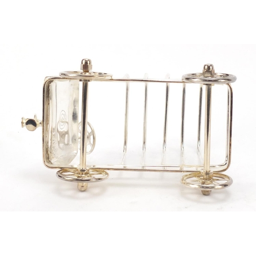 271 - Novelty silver plated toast rack in the form of a car with rotating wheels, 17cm in length