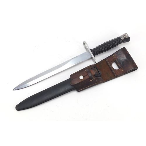 691 - German military interest bayonet with scabbard and leather frog, 38cm in length
