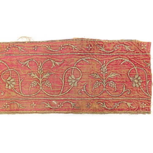 629 - Two 17th century Indian Mughal textile fragments embroidered with flowers, each 88.5cm x 22.5cm