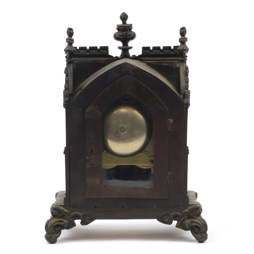 35 - 19th century cast iron Gothic bracket clock striking on a bell, with silvered dial and Roman numeral... 