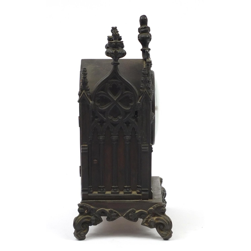 35 - 19th century cast iron Gothic bracket clock striking on a bell, with silvered dial and Roman numeral... 