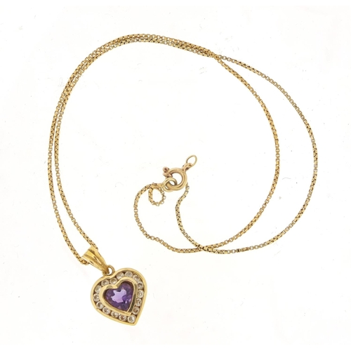 605 - 14ct gold amethyst and clear stone love heart pendant, 2cm in length on an unmarked gold coloured me... 