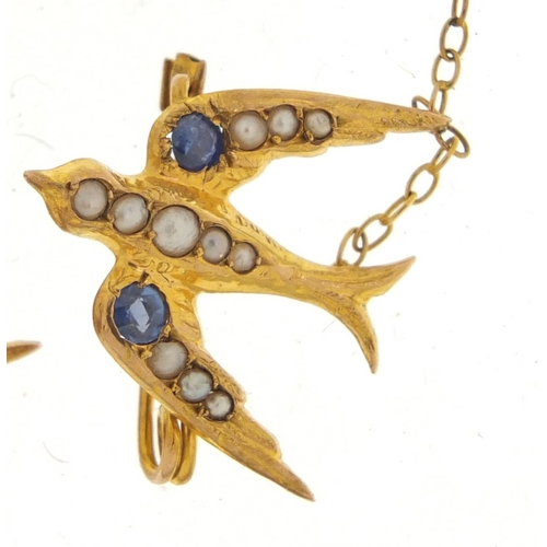 40 - 9ct gold swallow design brooch set with seed pearls and sapphires, 10.5cm in length, 2.2g