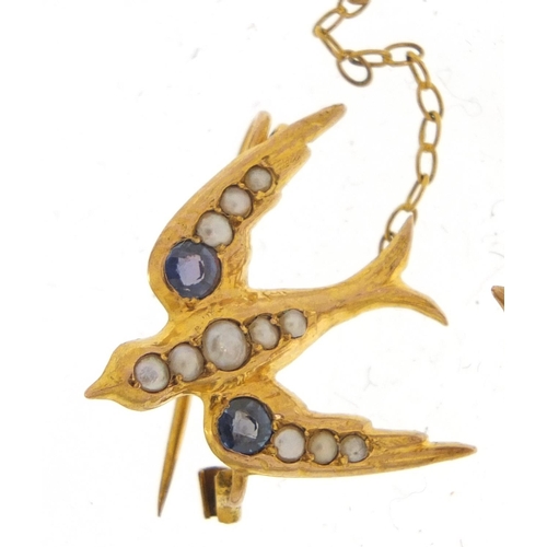 40 - 9ct gold swallow design brooch set with seed pearls and sapphires, 10.5cm in length, 2.2g