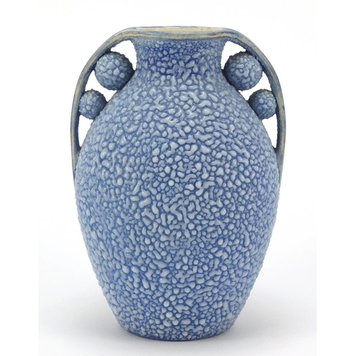 105 - French Art Deco twin handled pottery vase having a blue glaze, numbered 595 to the base, 19.5cm high