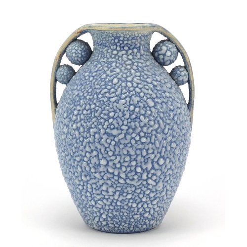 105 - French Art Deco twin handled pottery vase having a blue glaze, numbered 595 to the base, 19.5cm high