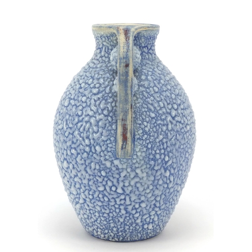 105 - French Art Deco twin handled pottery vase having a blue glaze, numbered 595 to the base, 19.5cm high