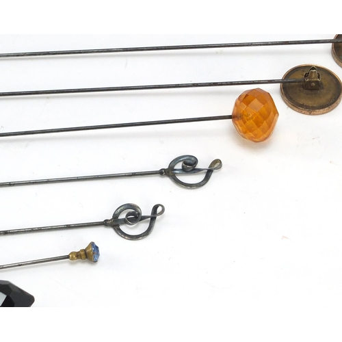 155 - Early 20th century an later hat pins including a silver pair of treble clef form by Charles Horner a... 