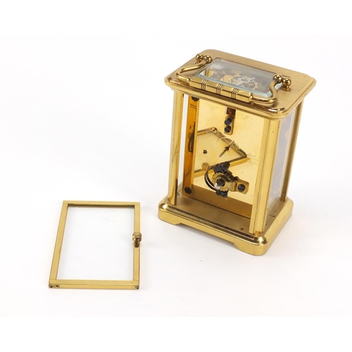 302 - Brass cased carriage clock with Roman numerals by William Widdop, 10.5cm high