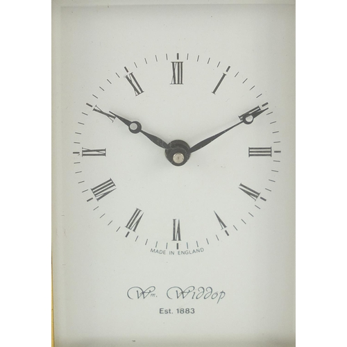 302 - Brass cased carriage clock with Roman numerals by William Widdop, 10.5cm high