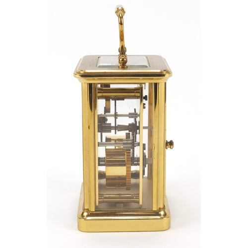 302 - Brass cased carriage clock with Roman numerals by William Widdop, 10.5cm high