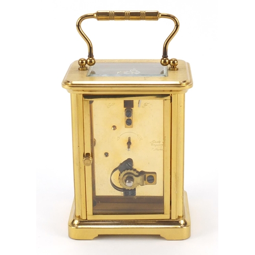 302 - Brass cased carriage clock with Roman numerals by William Widdop, 10.5cm high