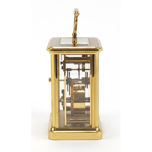 302 - Brass cased carriage clock with Roman numerals by William Widdop, 10.5cm high