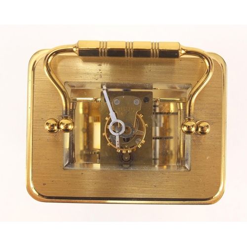 302 - Brass cased carriage clock with Roman numerals by William Widdop, 10.5cm high