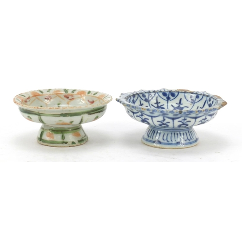 574 - Two Chinese porcelain pedestal dishes hand painted with flowers, the largest 11cm in diameter