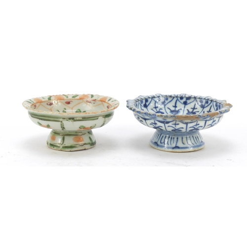 574 - Two Chinese porcelain pedestal dishes hand painted with flowers, the largest 11cm in diameter