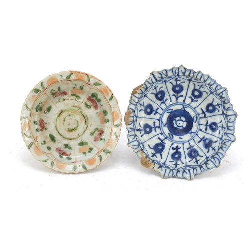 574 - Two Chinese porcelain pedestal dishes hand painted with flowers, the largest 11cm in diameter