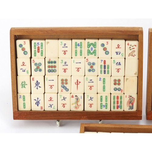 753 - Chinese mahjong set housed in a camphor wood five drawer chest carved with figures, 15.5cm H x 20.5c... 