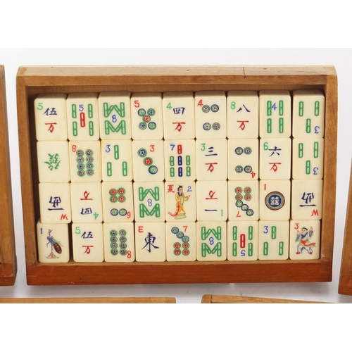 753 - Chinese mahjong set housed in a camphor wood five drawer chest carved with figures, 15.5cm H x 20.5c... 