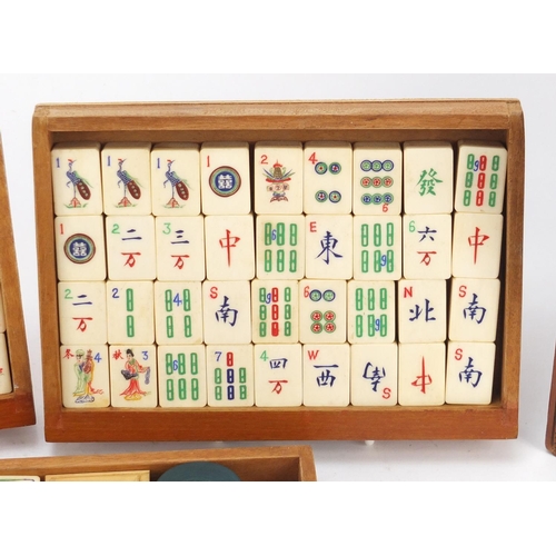 753 - Chinese mahjong set housed in a camphor wood five drawer chest carved with figures, 15.5cm H x 20.5c... 