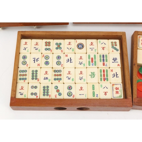 753 - Chinese mahjong set housed in a camphor wood five drawer chest carved with figures, 15.5cm H x 20.5c... 