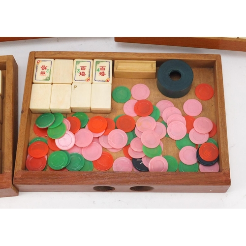 753 - Chinese mahjong set housed in a camphor wood five drawer chest carved with figures, 15.5cm H x 20.5c... 