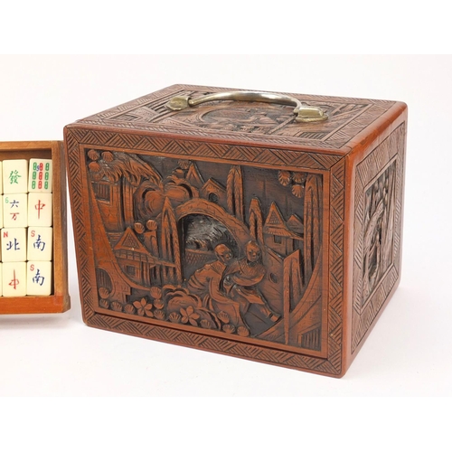 753 - Chinese mahjong set housed in a camphor wood five drawer chest carved with figures, 15.5cm H x 20.5c... 