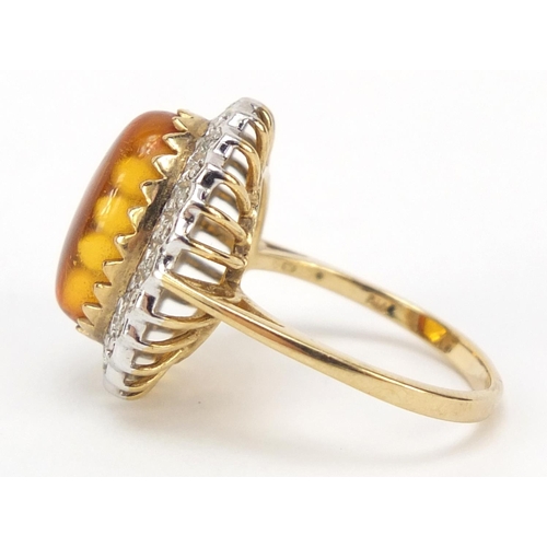 427 - 9ct gold cabochon amber and diamond ring, size N, 4.0g