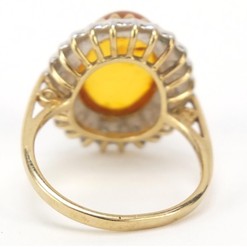 427 - 9ct gold cabochon amber and diamond ring, size N, 4.0g