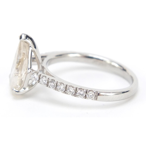 207 - Platinum pear shaped diamond ring, set with fourteen diamonds to the shoulders, size L, 4.3g