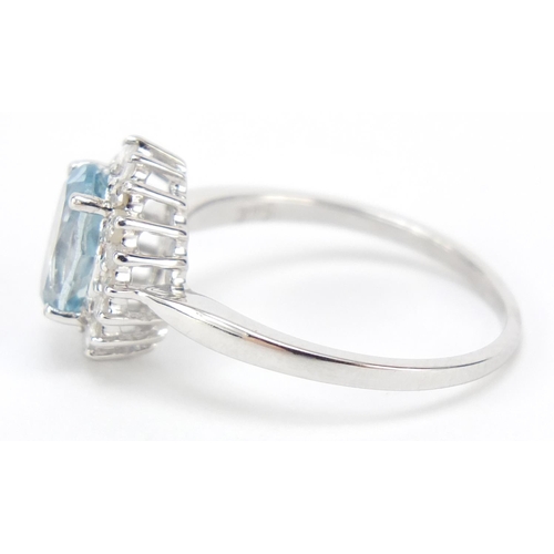 469 - 9ct white gold blue topaz and diamond ring, size L, 2.1g