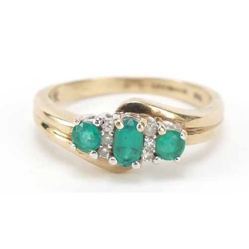 686 - 9ct gold green stone and diamond crossover ring, size M, 2.5g