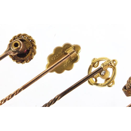 246 - Seven Victorian gold and white metal stick pins including, diamonds, turquoise, ruby and green tiger... 