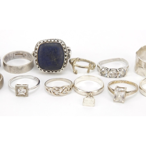 402 - Seventeen silver and white metal rings, some set with semi precious stones, 91.0g