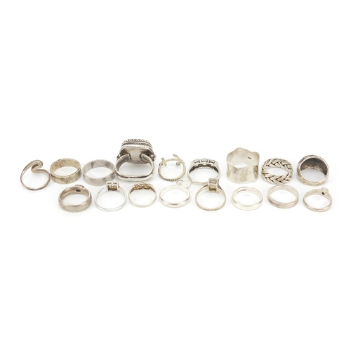 402 - Seventeen silver and white metal rings, some set with semi precious stones, 91.0g