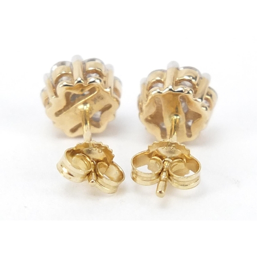 15 - Pair of 9ct gold diamond flower head earrings, approximately 1 carat in total, 1.5g