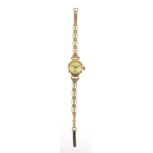 249 - 9ct gold ladies Courvoisier Freres wristwatch with gold plated strap, the case 20mm wide