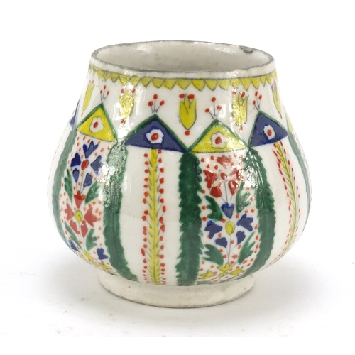 231 - 19th century Turkish Kutahya pottery mug, hand painted with flowers, 11cm high