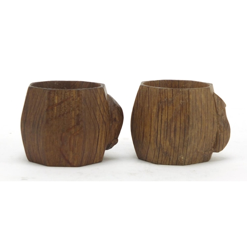 3 - Robert Mouseman Thompson pair of octagonal adzed oak napkin rings, each carved with a signature mous... 