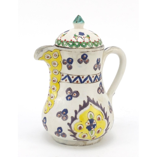 232 - Turkish Kutahya pottery coffee pot hand painted with flowers, 18cm high
