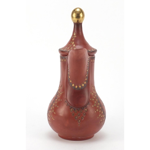 233 - Turkish Tophane terracotta water jug incised and painted with flower heads, 27cm high