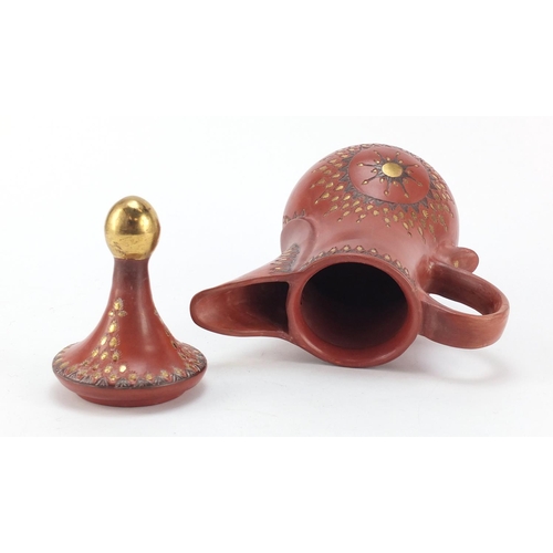 233 - Turkish Tophane terracotta water jug incised and painted with flower heads, 27cm high