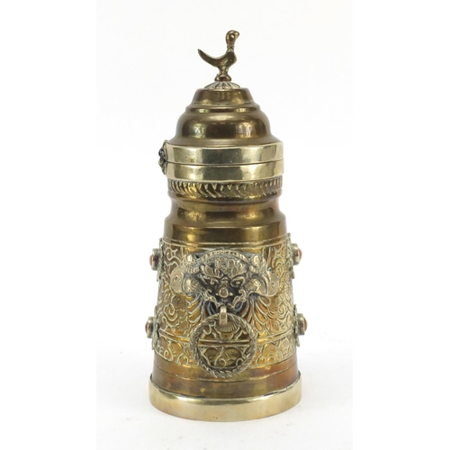 616 - Tibetan brass pot with hinged lid and ring handles, 22.5cm high