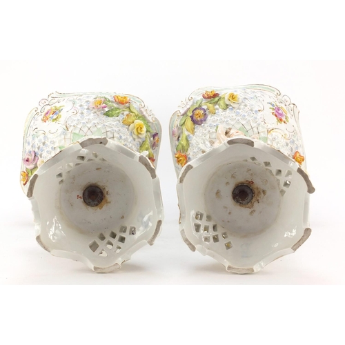 735 - Large pair of Dresden floral encrusted porcelain centrepieces with pierced baskets on naturalistic s... 